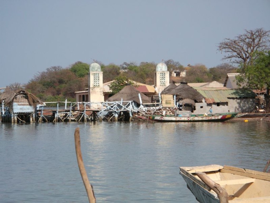 Riverside village and wooden jetty at Tendaba on the Gambia River
